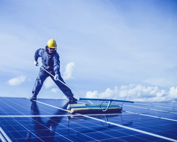 man, solar panel, rooftop-5680696.jpg