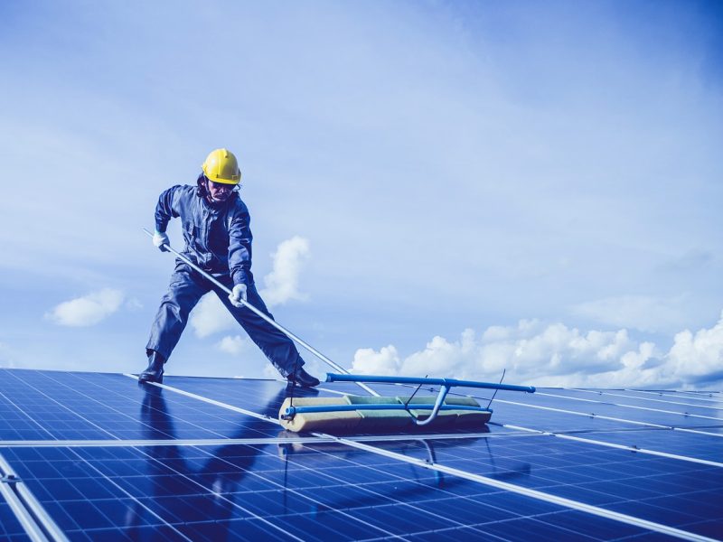 man, solar panel, rooftop-5680696.jpg